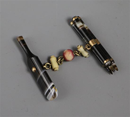 An early 20th century clasp?, modelled as a banded agate and ivory cricket bat, stumps ,bails and ball, bat 42mm.